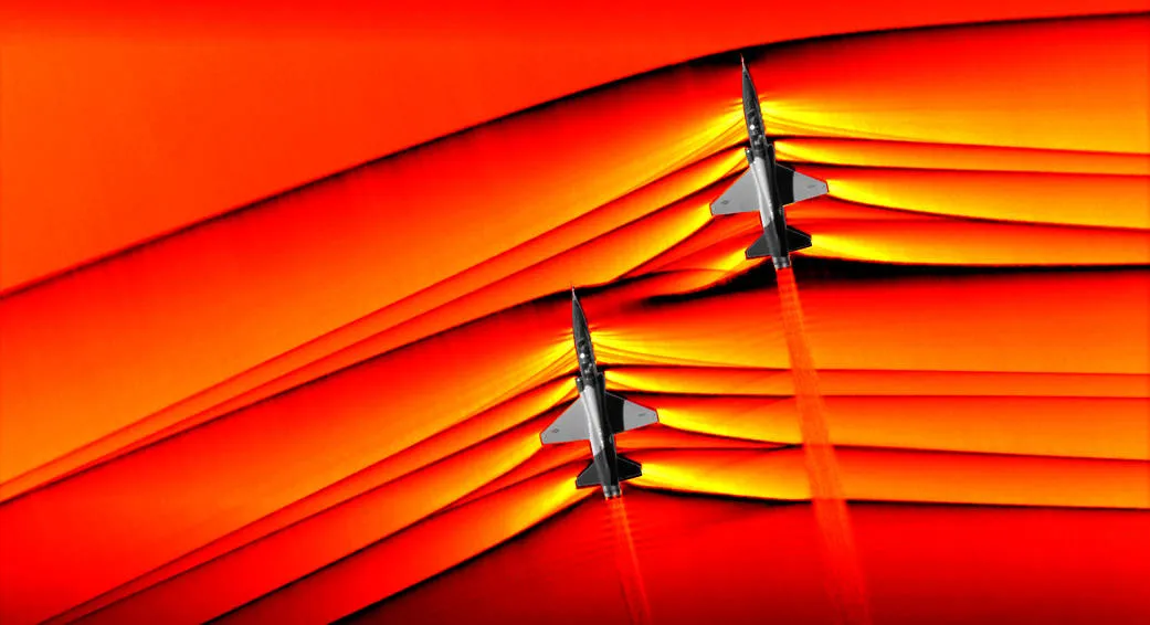 Schlieren photograph showing pressure waves around a T-38 aircraft in supersonic flight